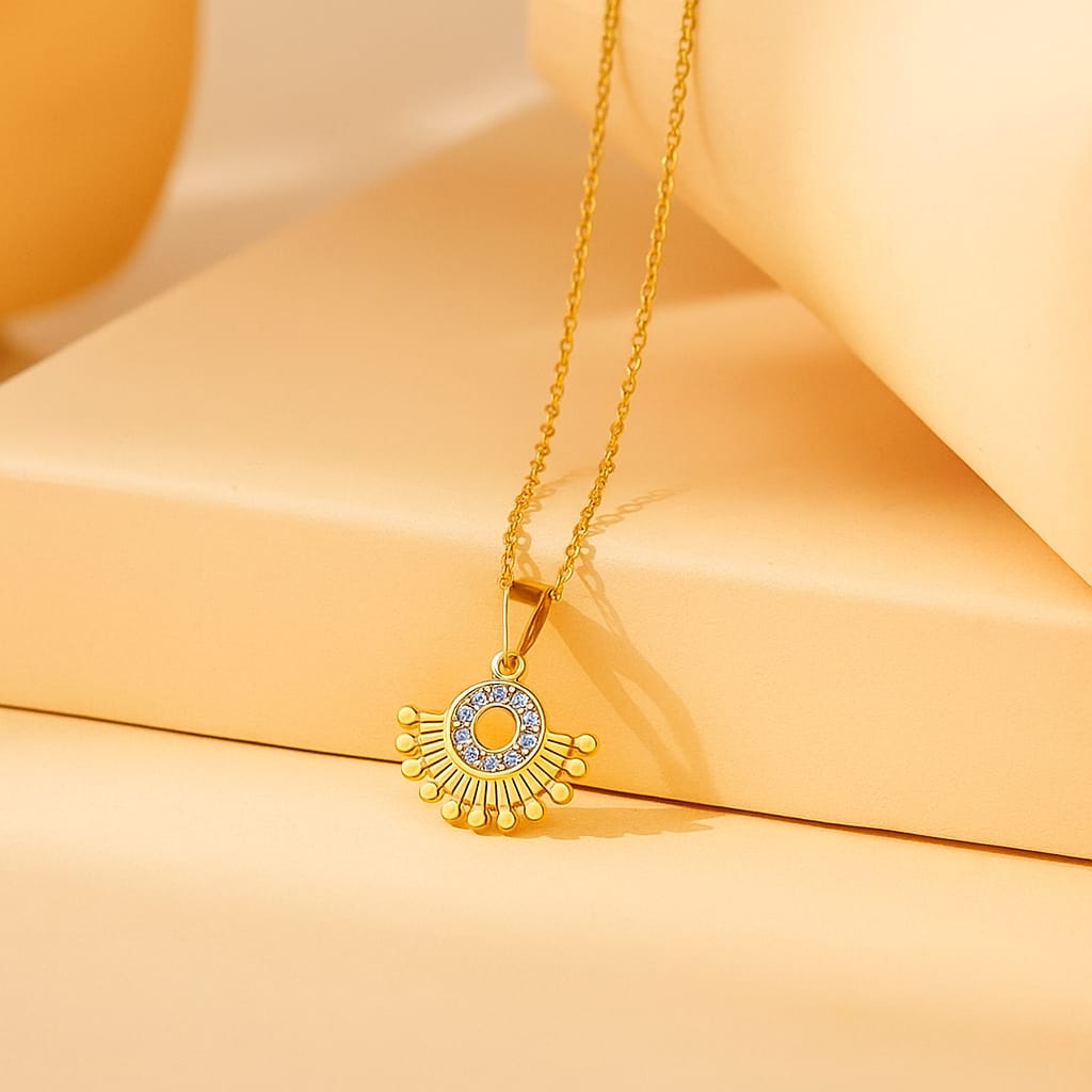 Designer round gold-plated pendant with crystal stones
Ethnic-inspired gold-plated necklace with dotted fan shape
Statement jewellery piece with gold finish and designer pendant
Saiyra radiant pendant necklace for festive or party look
Chic gold necklace with intricate detailing and shine