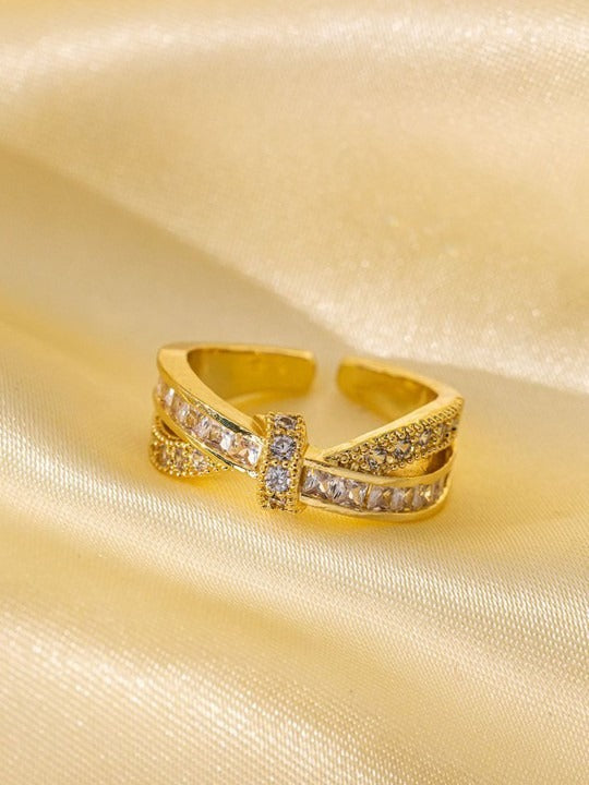 Gold adjustable ring with stone setting
Saiyra luxe ring on satin background
Elegant gold-plated ring for women
Anti-tarnish designer ring India
Stylish gold finger ring with stones