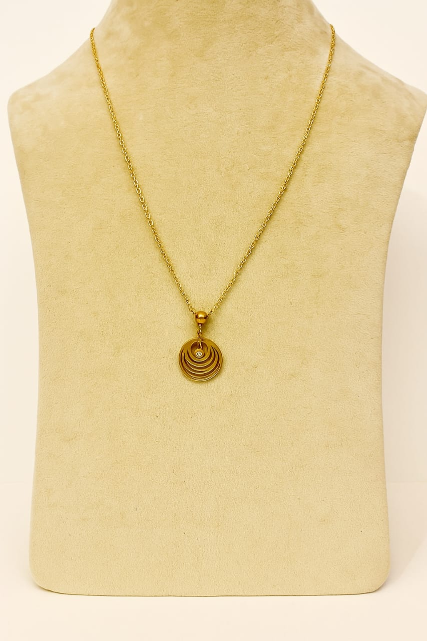 Gold necklace with a circular pendant 

Gold plated necklace

Minimal jewellery for office

Saiyra gold pendant

Affordable artificial jewellery

Dainty necklace design

