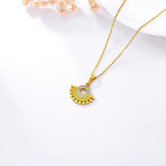 Elegant fan-shaped gold-plated pendant necklace with zircon stones 
Designer gold pendant necklace with round center and sunray detailing
Minimalist gold-plated jewellery piece for everyday wear
Saiyra luxe necklace with golden fan design and clear crystals
Elegant gold chain necklace for women with unique pendant shape




