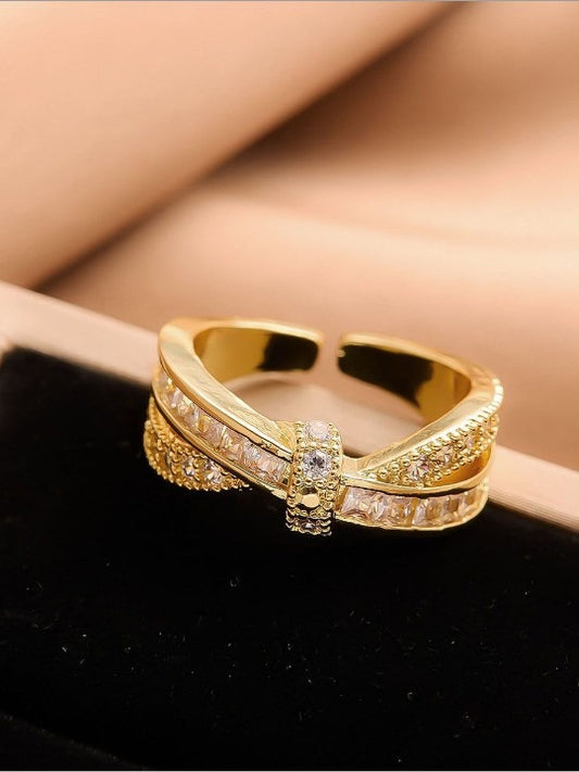 Gold ring with diamond accents 

closeup of Saiyra ring

stylish anti-tarnish ring

bridal imitation ring

shiny gold-tone ring

designer ring display